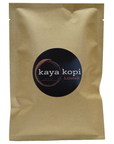 Kraft paper packaging with a 'kaya kopi Luwak' label on a white background
